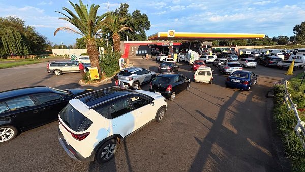 Cars queue at a Shell petrol station in Johannesburg, South Africa
