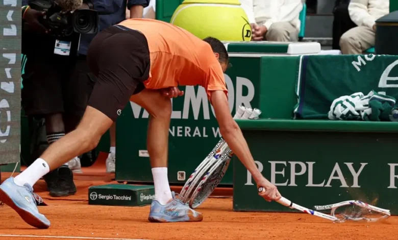 Daniil Medvedev smashes his racket on the clay during his game against Matteo Berrettini