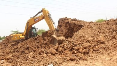 An earth moving machine working on the ongoing Afienya-Dodowa road project