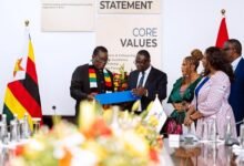 Dr. Agyepong (second from left) presenting a gift to President Mnangagwa of Zimbabwe
