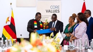Dr. Agyepong (second from left) presenting a gift to President Mnangagwa of Zimbabwe