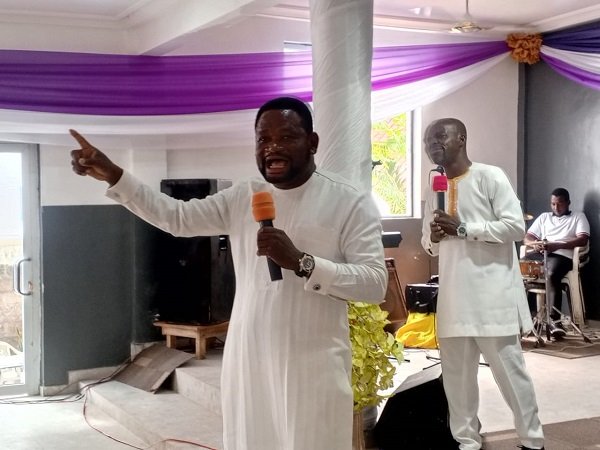 Rev. Doe delivering the sermon