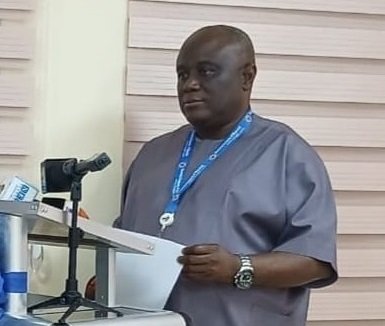 Mr Appoe (inset) addressing the press