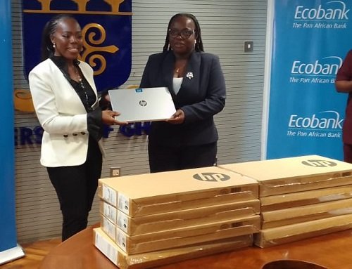 Mrs Osei-Poku (left) presenting the laptops to Prof Amfo