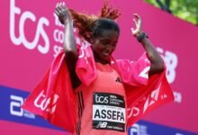 Ethiopia's Tigst Assefa celebrates after winning the women's elite race