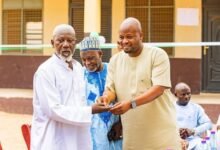 Alhaji Tikumah. (right) Aid to Former Finance Minister, Dr Amin, handing over the keys to the building to Alhaji Mallam, Head of Islamic instructors