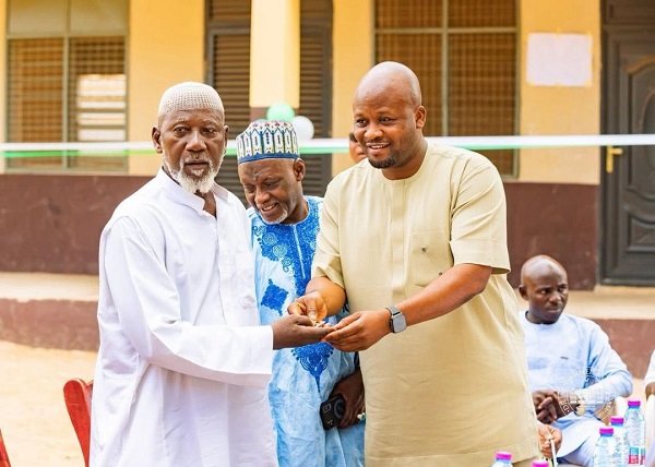 Alhaji Tikumah. (right) Aid to Former Finance Minister, Dr Amin, handing over the keys to the building to Alhaji Mallam, Head of Islamic instructors