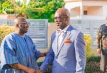 Former Vice President Dr Bawumia (left) exchanging greetings with Rt Rev Dr Dogbe