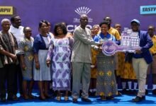 Mr Parent, (right), symbolically handing over the key to the ICT Lab to Mrs Ahiagba (middle)