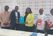 Ms Addy (third from right), and Mr Worlanyo displaying the MoU after the workshop in Ho