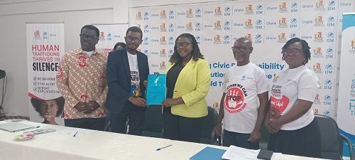 Ms Addy (third from right), and Mr Worlanyo displaying the MoU after the workshop in Ho