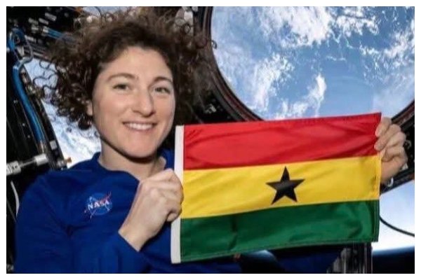Christina Koch with Ghana flag