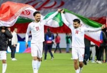 Iran's players celebrate after qualifying for the World Cup