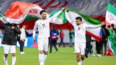 Iran's players celebrate after qualifying for the World Cup