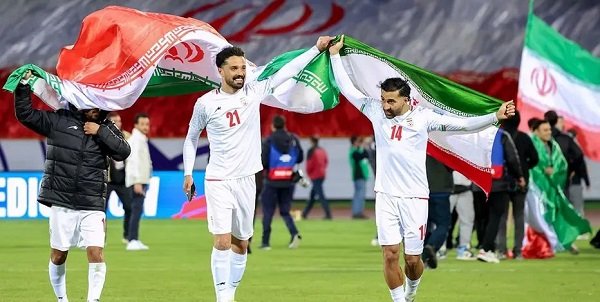 Iran's players celebrate after qualifying for the World Cup