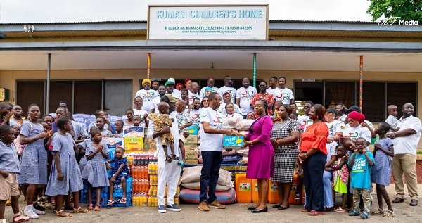 Mr Nabali (second from left, front row) presenting the items to Ms Amponsah