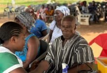 A nurse taking vitals at the health screening