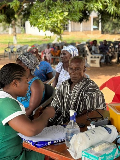 A nurse taking vitals at the health screening