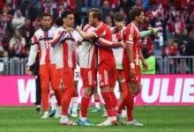 Kane celebrates with Bayern Munich teammates after winning the 2025-26 Bundesliga title