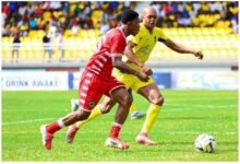 Kotoko's Lawson Kyei Manu battles Medeama defeder Fatawu Sulemana for possession