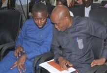 Dr Peprah (left) interacting with Dr Asiedu-Bekoe during the programme Photo Victor A. Buxton