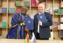 Mayor for KoKMA Alfred Gaisie and Kotovsk City Mayor Alexey Plakhotnikov in a hand shake after the cooperation renewable