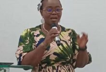 Ms Olatayo (inset) addressing the participants at the programme