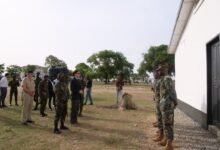 Mr Landshoeft (front row, second from left) being welcomed by the military personnel during his visit