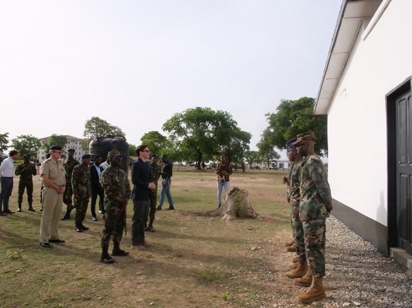 Mr Landshoeft (front row, second from left) being welcomed by the military personnel during his visit
