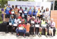 Mr Skinnebach (standing, fourth from right) together with members of the Team Europe Cycling relay and the Gladiators