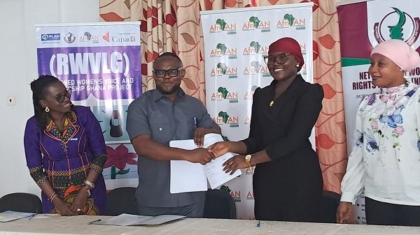 Mr Tei-Nobi (second from left) shaking hands with Ms Janat Issifu after signing the contract. With them is Ms Asare (left)