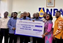 Mr Tameklo (third from left) presenting the ceremonial cheque to Ms Obuobia Darko-Opoku (second from right) and other members of both organisations present