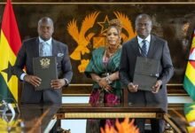 Officials of the two institutions displaying the signed documents