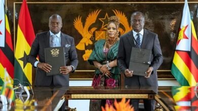 Officials of the two institutions displaying the signed documents