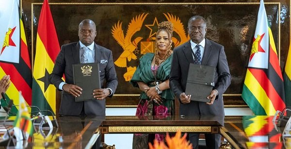 Officials of the two institutions displaying the signed documents