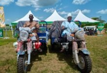 Beneficiary farmers with their tricycles to aid their farming activities