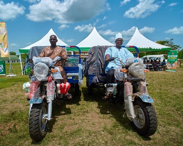 Beneficiary farmers with their tricycles to aid their farming activities