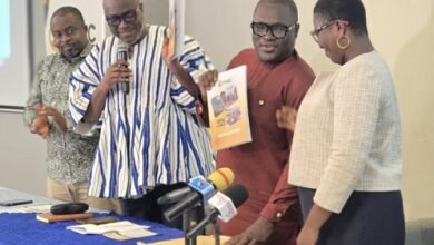 Prof Prempeh (second from left) being assisted by Mr Ellimah (second from right) to launch the report