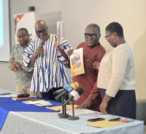 Prof Prempeh (second from left) being assisted by Mr Ellimah (second from right) to launch the report