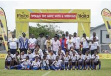 Players and officials of Ampem Darkoa with the trophy