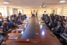 Mr Yohuno (seated, middle) addressing the officers