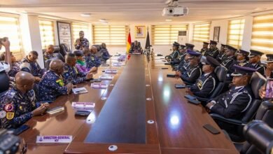 Mr Yohuno (seated, middle) addressing the officers