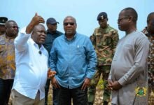 President Mahama (middle) being briefed on tidal waves affected communities by Mr Gunu (left)
