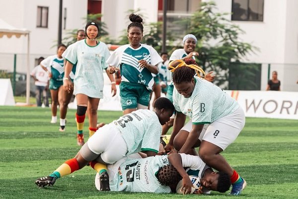 Princess Avorkah (left) and team mate Hilaria Wuaku tackling a Nigeria player