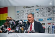 Queiroz answering questions from the media