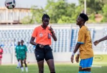 Referee Rita Nkansah explains a point to Hasaacas Ladies player Millot Abena Pokuaa