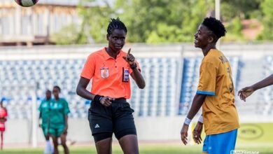 Referee Rita Nkansah explains a point to Hasaacas Ladies player Millot Abena Pokuaa