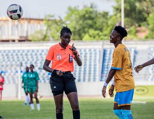 Referee Rita Nkansah explains a point to Hasaacas Ladies player Millot Abena Pokuaa