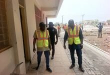 Mr Ndebilla (left) and Mr Ayamwego inspecting the project