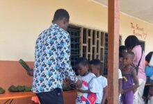 Some of the children in a queue for their meals